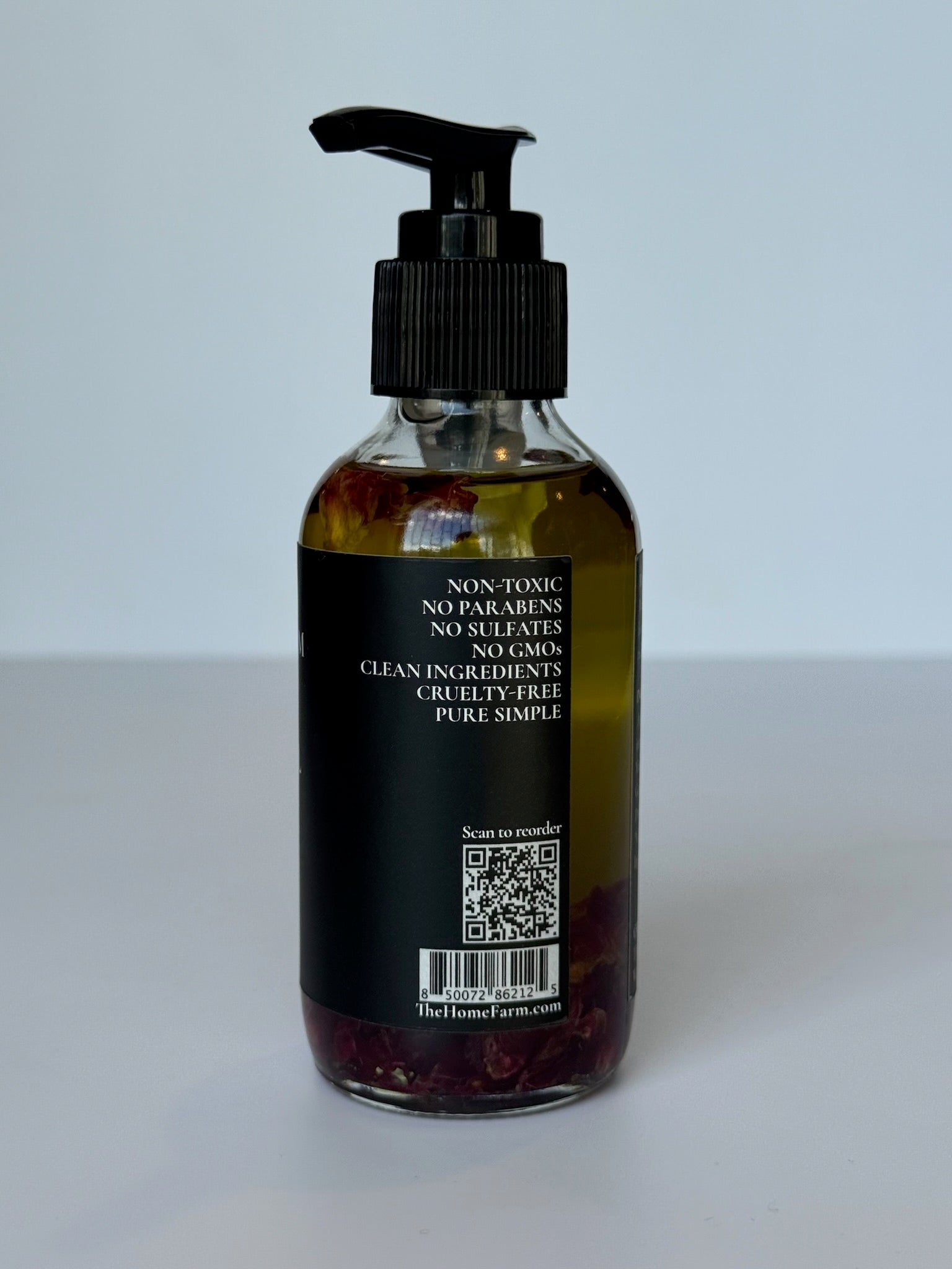Rose body oil product with natural ingredients and packaging details